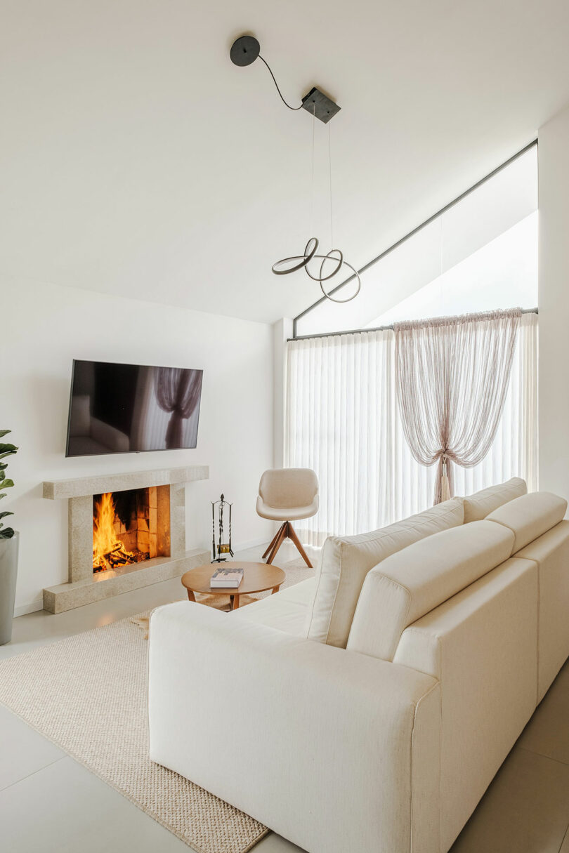 angled interior view of modern white living room